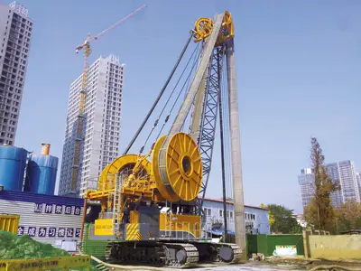 A BAUER MC 128 duty-cycle crane with BC 50 cutter on a diaphragm wall site for a tunnel project in Nanjing, China